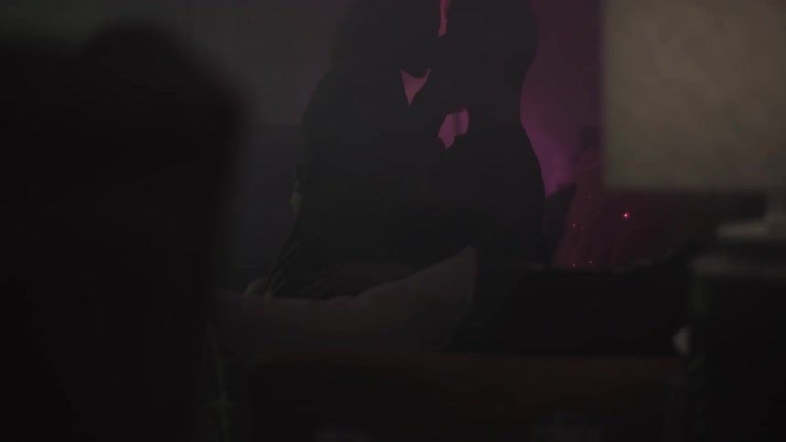 A couple are making out in a dark room