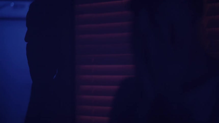 Silhouette of a person covering their face with their hands