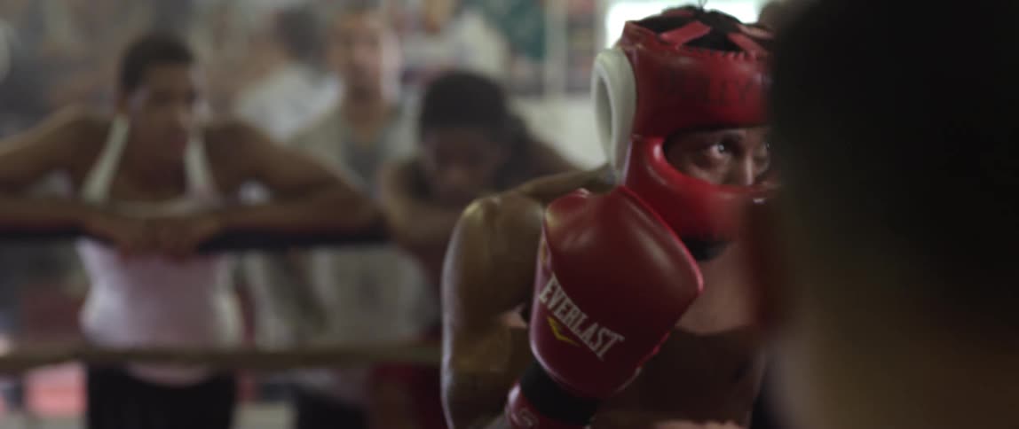 Man guards up as he advances on another fighter