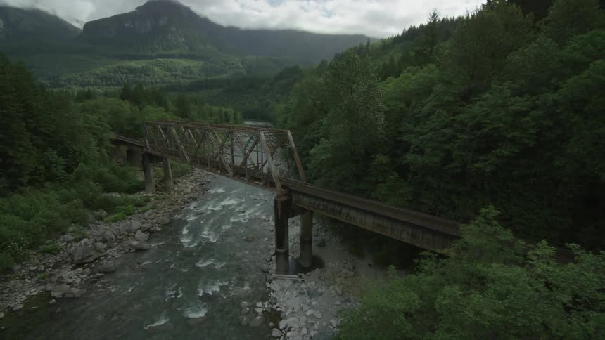 A bridge over a small river as seen from above