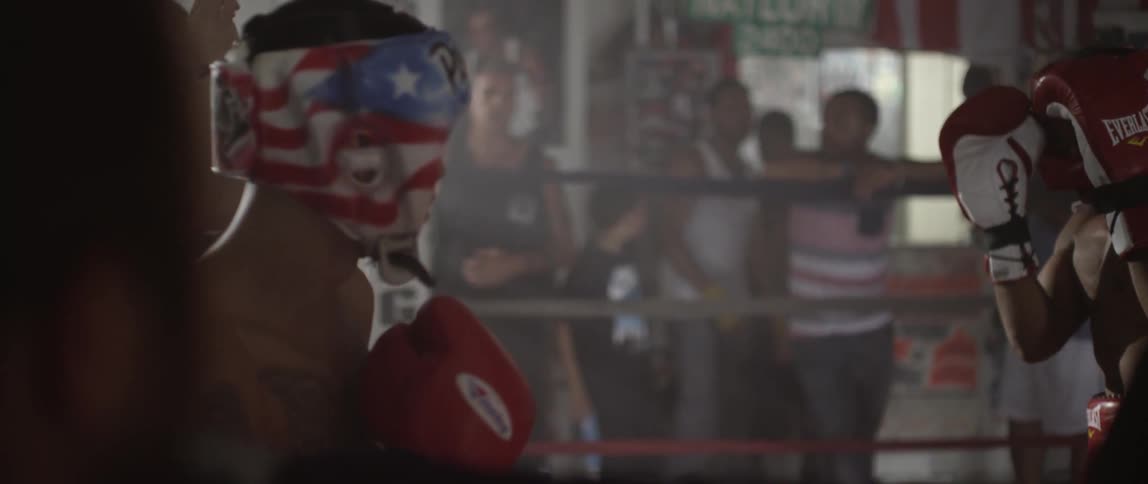 People boxing in a gym