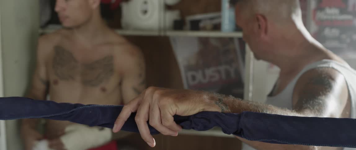 Boxer grabbing a glove and walking away