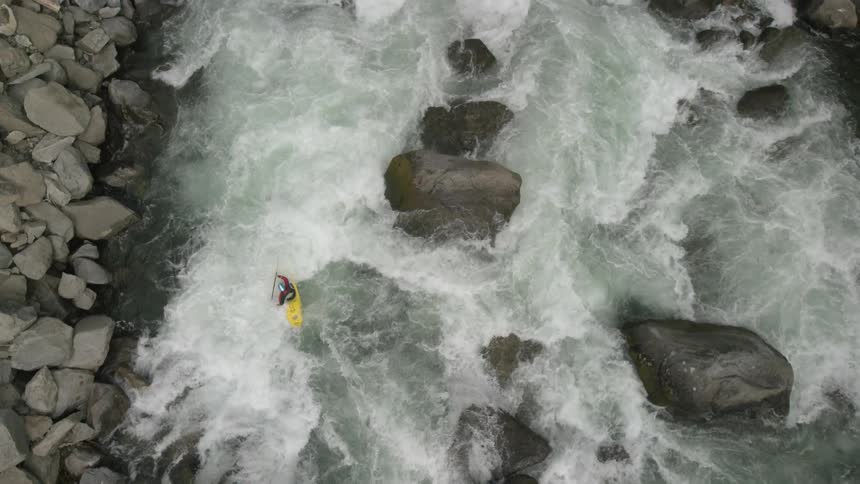 Aerial view of a person kayaking down a river