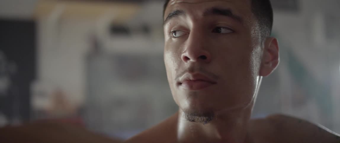 Man stares forward before turning his head