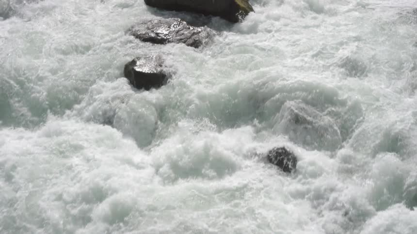Rapid waters over some big rocks