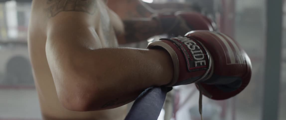 A person wearing boxing gloves
