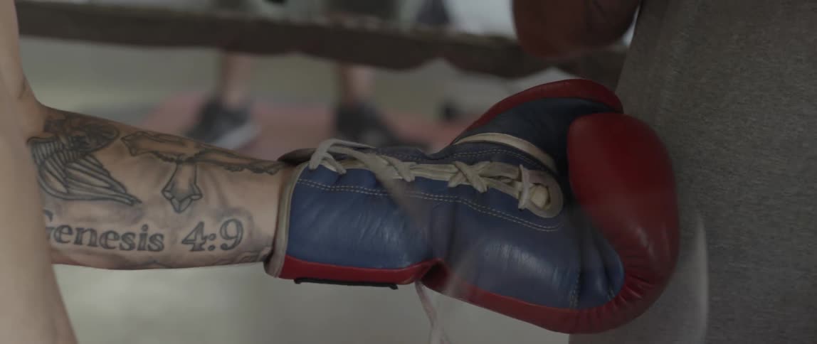 A person having their gloves tied