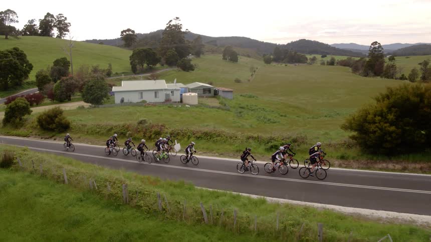A group of cyclists on a rural road