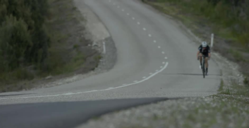 A cyclists rides on an empty street