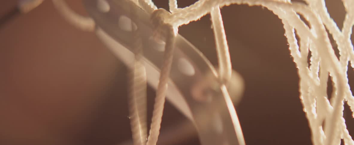 Twine is being laced through holes