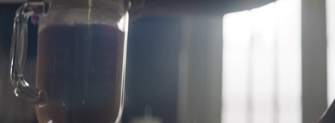Liquid is being blended in a blender