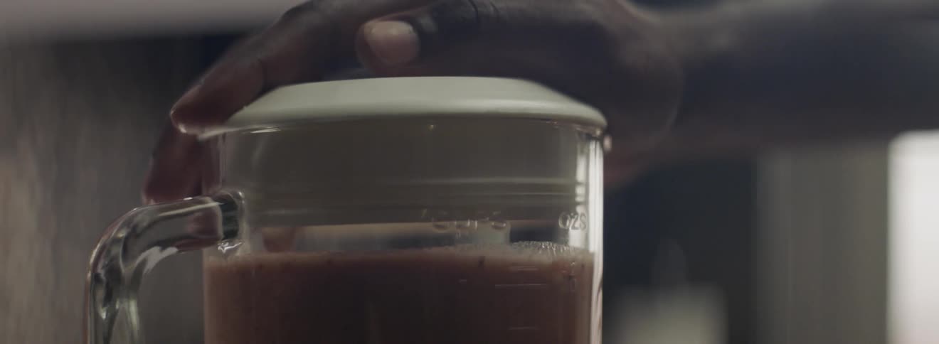 A person uses a blender