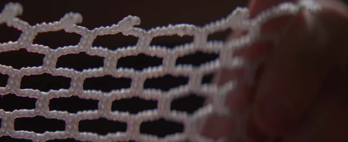 Person stretches a net in their hands
