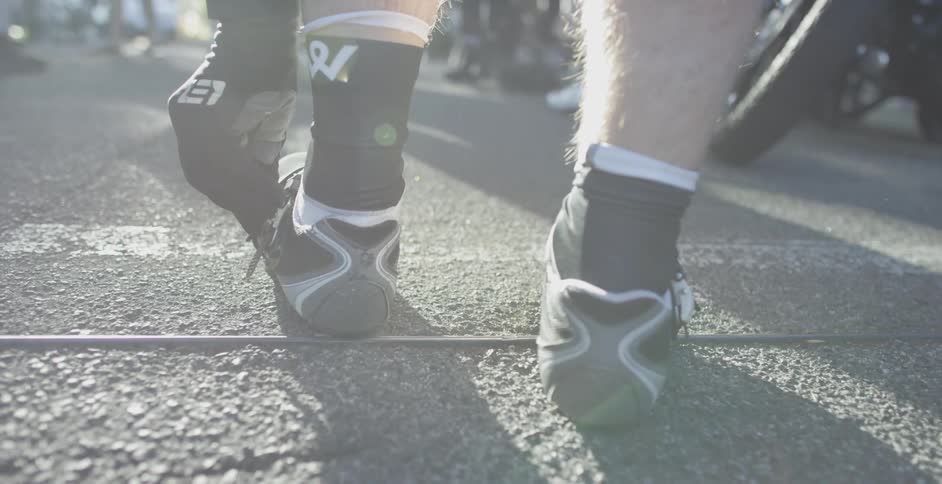A man buckles his shoe