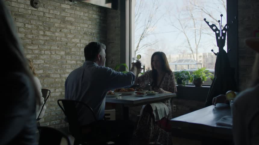 A man and woman dine in a restaurant