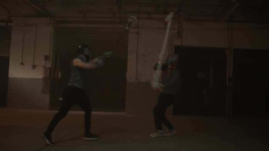 A player dodge sand swings his stick in the other direction