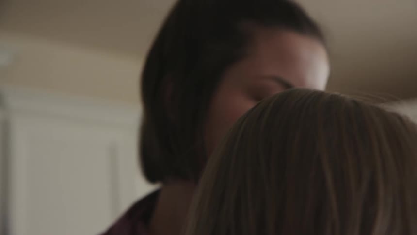 A mother and child are working in a room