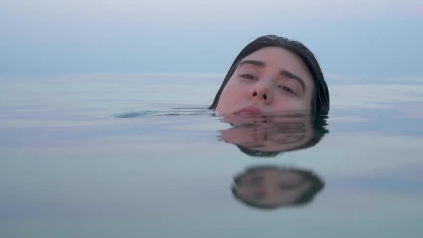 A woman floats in the water
