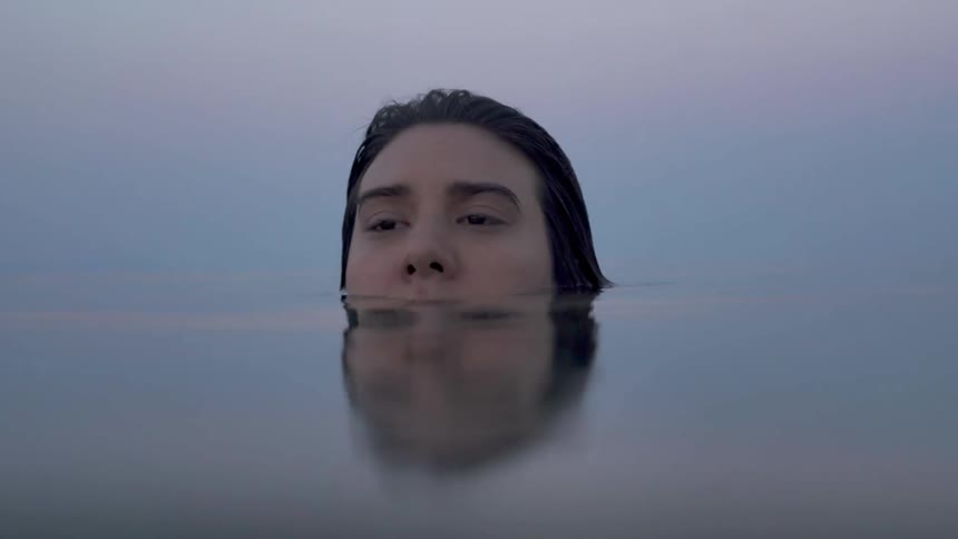 A woman floats in the water