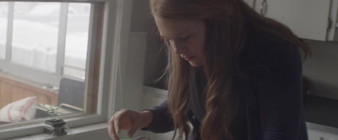 Women decorate sugar cookies at home