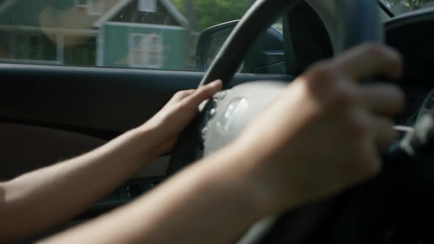 A person drives a car