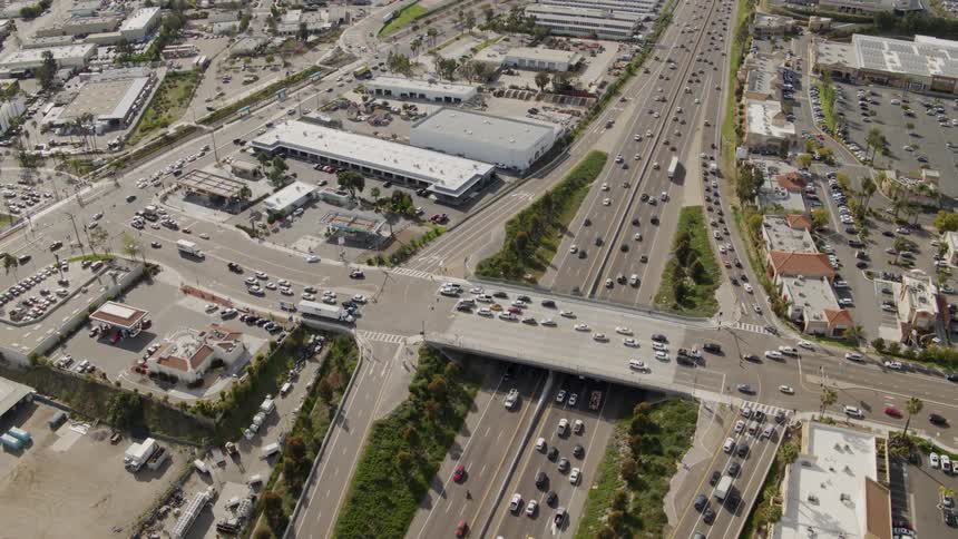 Cars drive on a city highway system