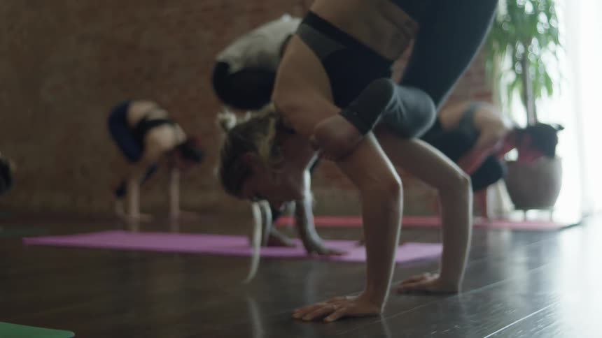 Women pose in a yoga class