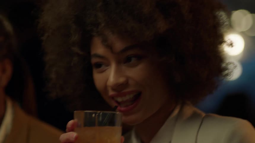 People talk and toast drinks together