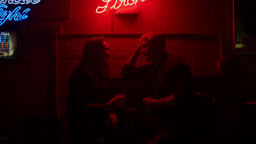 Man and woman talking in a bar