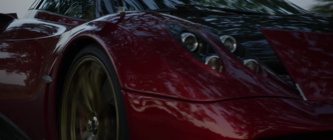 Close up of a supercar driving