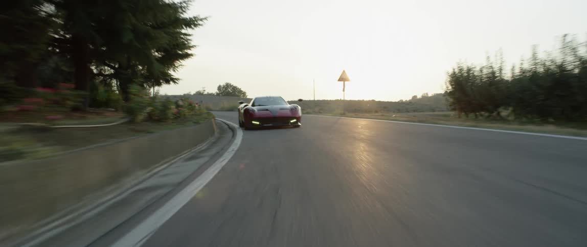 A person drives a fast sports car