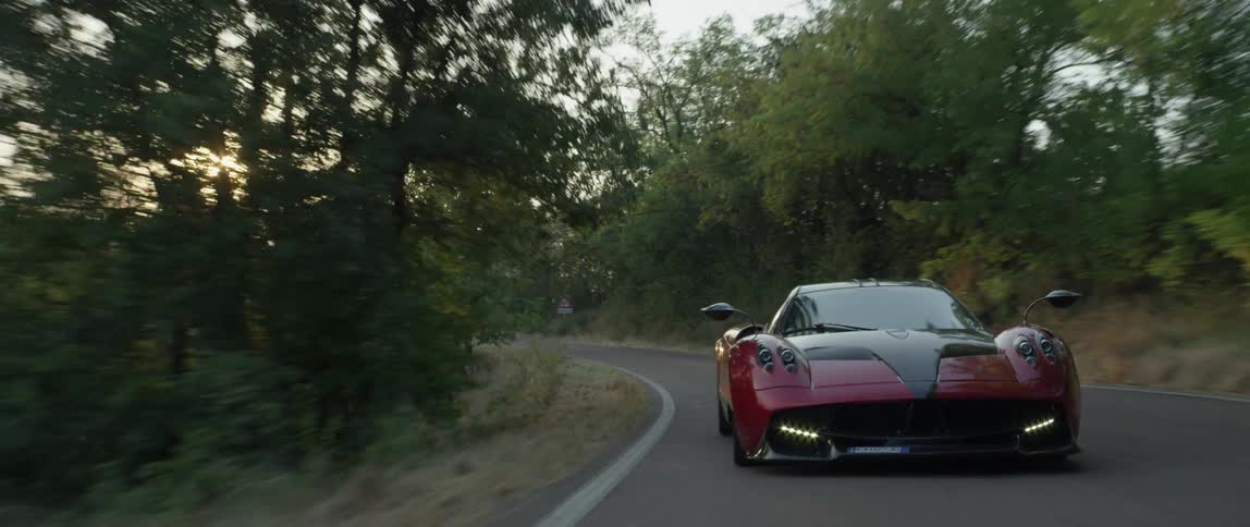 A person drives a fast sports car