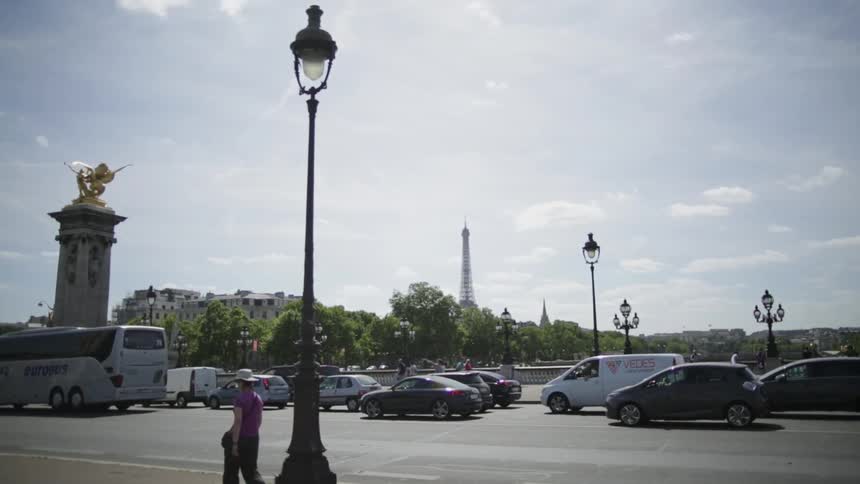 Vehicles and pedestrians commute in the city