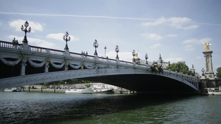 The long bridge has rough waters below
