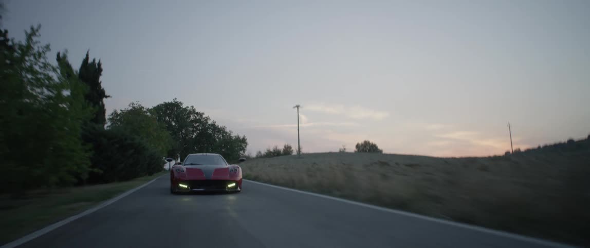 A person drives a fast sports car