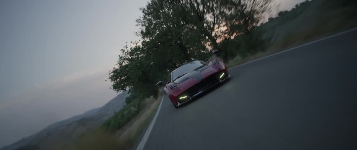 A person drives a fast sports car