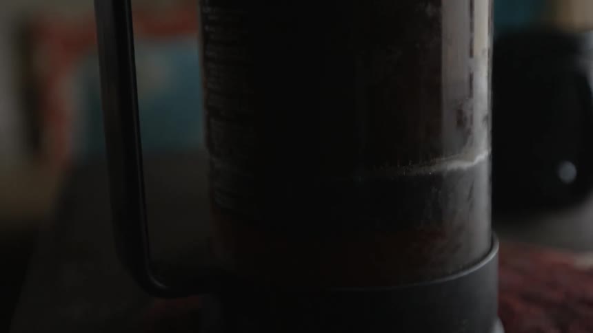 Coffee is pressed in a pot