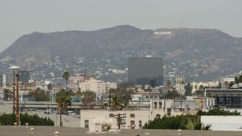 Cars drive in hollywood on a sunny day