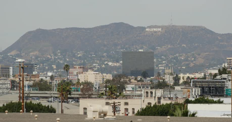 Cars drive in hollywood on a sunny day