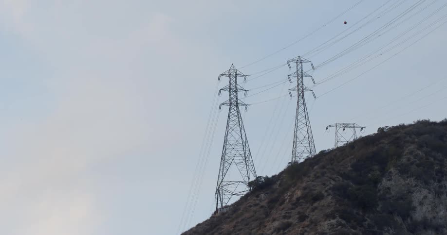 The large power lines are on the hill top