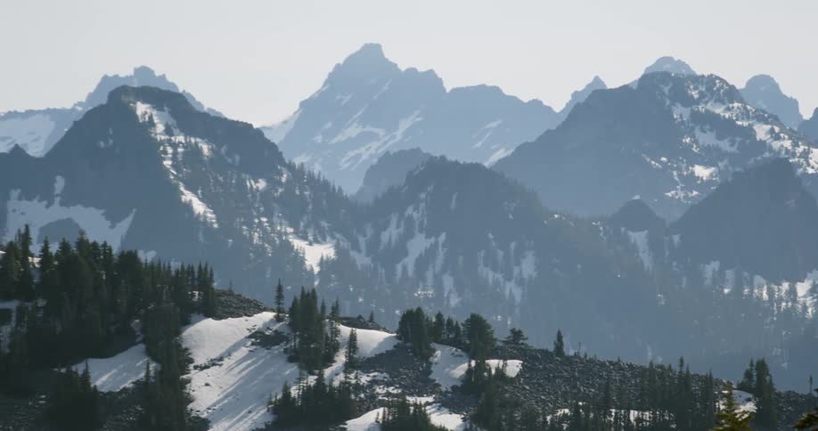 The tall mountains ahead are covered with snow