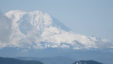 Snow and ice cover a mountain