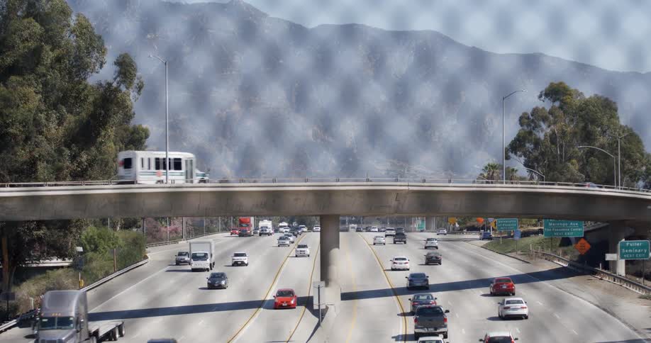 Cars travel on the highway under the overpass