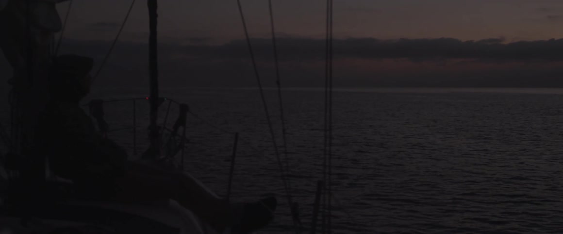 A boat travels on the ocean