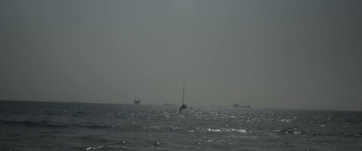 Boats can be seen sailing in the distance