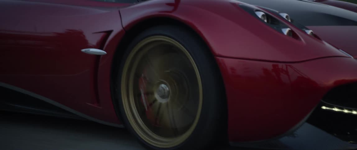 A sports car drives on a road