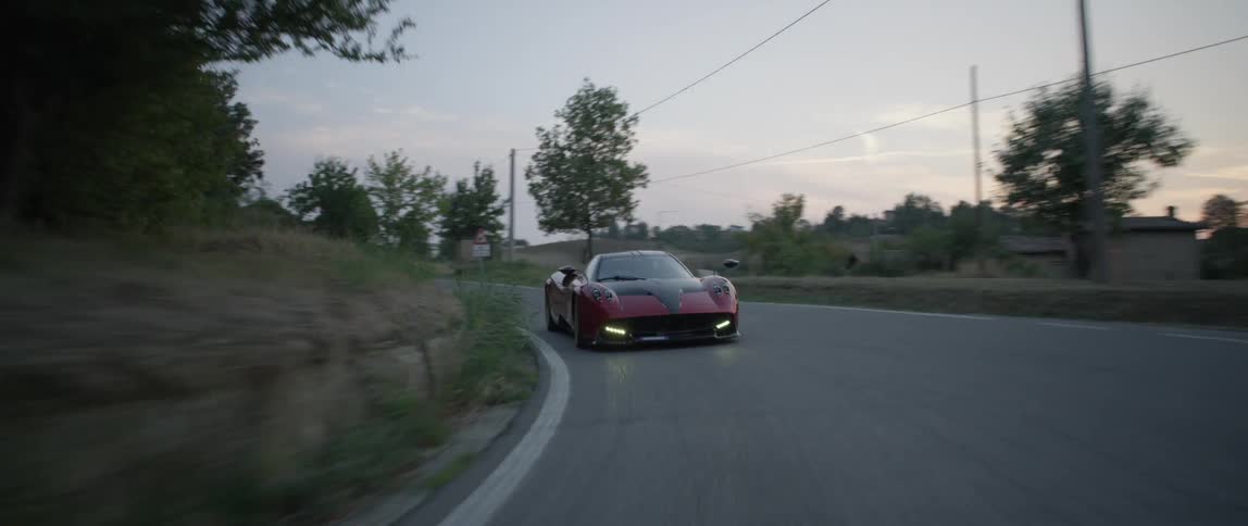 A person drives a fast sports car