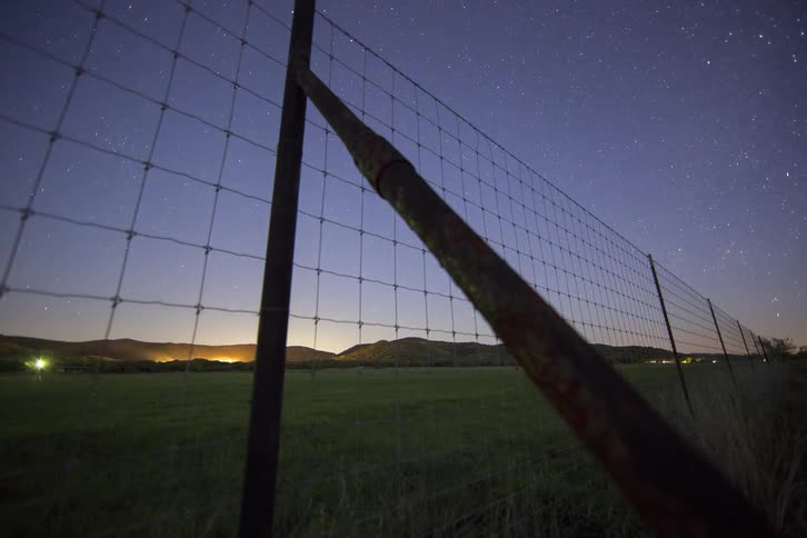 Stars emerge in the sky as the sun sets