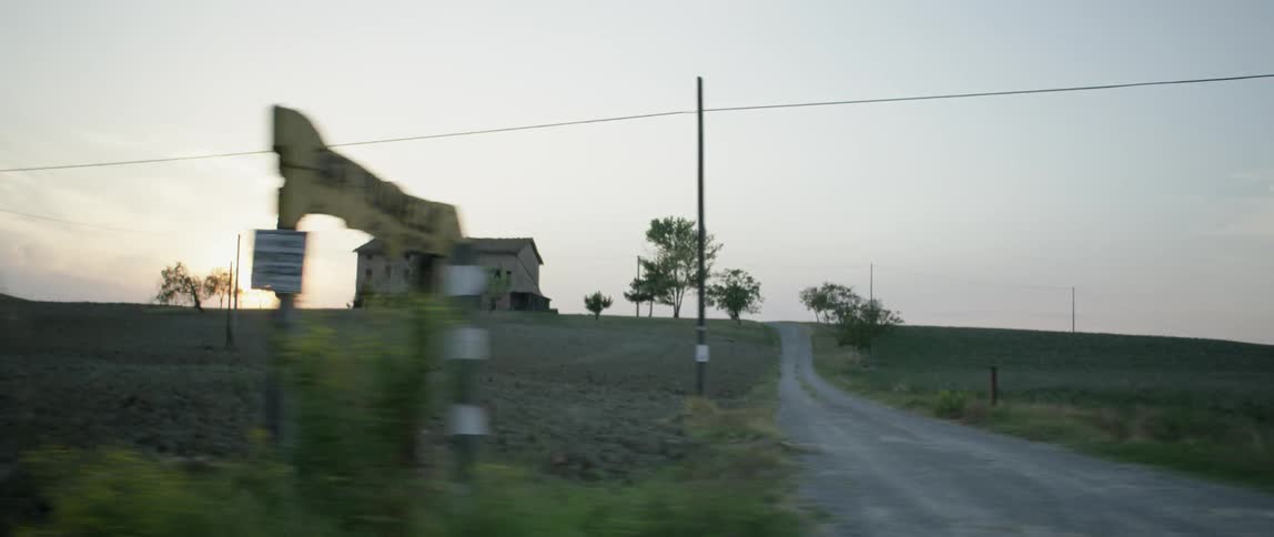 Traveling video of a building out in the country