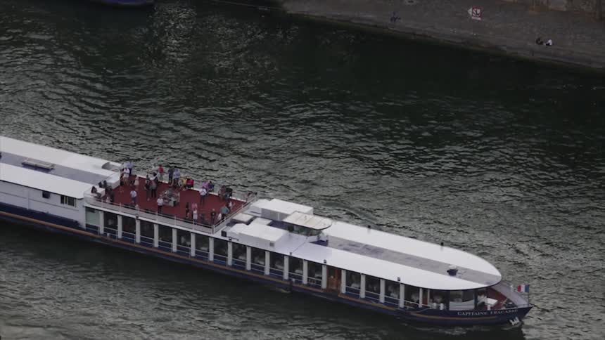 A boat floats on a body of water